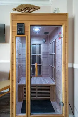 a room with a sauna with a door open at Champagne Studio with Sauna in Prague
