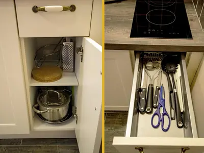 a kitchen cabinet filled with lots of utensils at Champagne Studio with Sauna in Prague