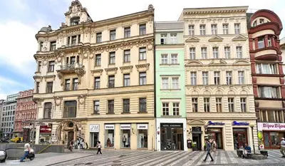 a group of buildings on a city street at Wishlist Old Prague Residences - New Town in Prague
