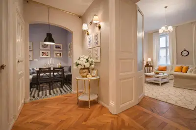 a hallway with a living room and a dining room at Wishlist Old Prague Residences - New Town in Prague
