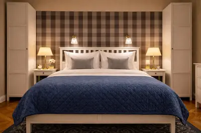 a bedroom with a large bed with a blue blanket at Wishlist Old Prague Residences - New Town in Prague
