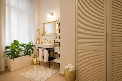 a bathroom with a sink and a mirror at Wishlist Old Prague Residences - New Town in Prague