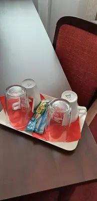 a tray with drinks and utensils on a table at HOTEL ARÉNA in Prague