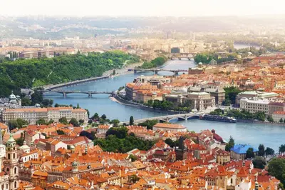 a view of a city with a river and buildings at Attic Apartment City Center in Prague