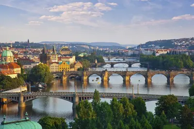 a view of a bridge over a river with a city at Attic Apartment City Center in Prague