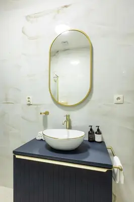 a bathroom with a sink and a mirror at Maiselova House in Prague