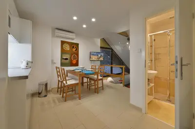 a kitchen and dining room with a table and chairs at A. V. Pension Praha in Prague