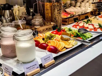 a buffet with many different types of food on display at Apartments Embassy by LH in Prague