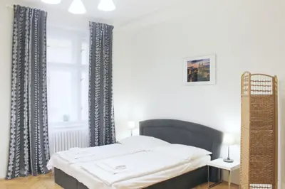 a bedroom with a bed and a window at Modern apartment Michalska 6 in Prague