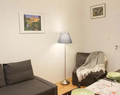a living room with a couch and a chair at Modern apartment Michalska 6 in Prague
