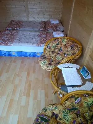 a room with two beds and two chairs at Prague Retro Challenge and Garden in Prague