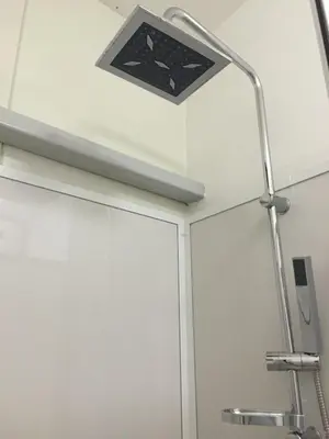 a bathroom with a shower with a light on the ceiling at Labe Aréna Račice in Štětí