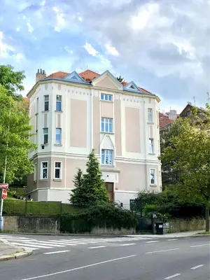 a large white building on the side of a street at Central-Modern-Apartment in Prague