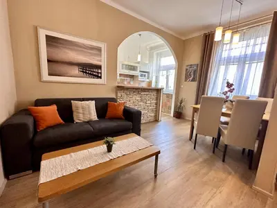 a living room with a couch and a table at Pension SKLEP in Prague
