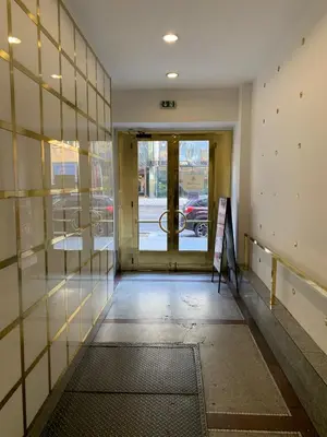 an empty hallway of a building with a glass door at Onefam Old Town in Prague