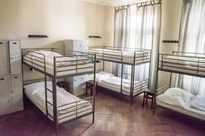 a group of four bunk beds in a room at Onefam Old Town in Prague