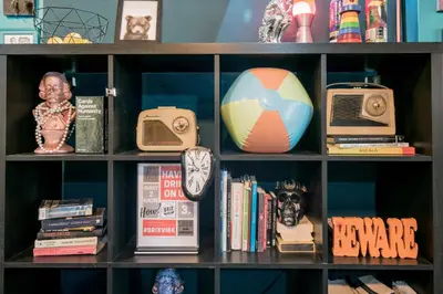 a book shelf filled with lots of items at Brix Hostel in Prague