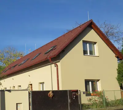 a house with a red roof at Rivendell Apartments in Prague