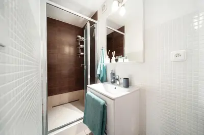 a bathroom with a toilet and a sink and a shower at Lovely Prague Havanska - with Free Parking in Prague