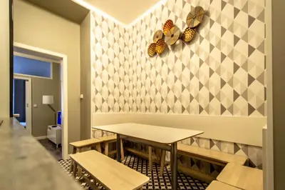 a dining room with a table and butterflies on the wall at Old Town Rybna Apt by Ruterra in Prague