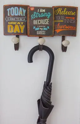 an umbrella is hanging on a wall with signs at Modern Apartment Zitna in Prague