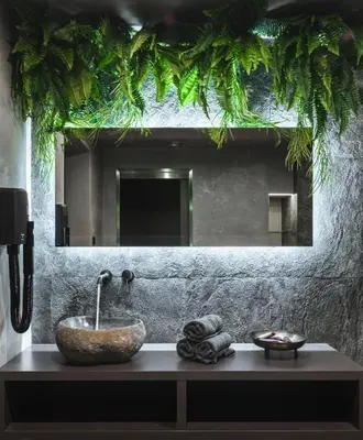 a bathroom with a sink and a mirror at Royal Apartmány in Dobříš