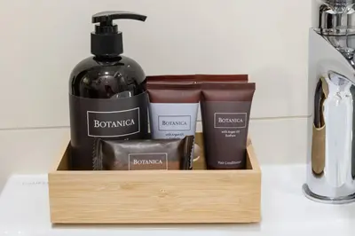 a wooden holder with a bottle of wine and other products at Romantic Bohemian Studio in Old Town Prague in Prague