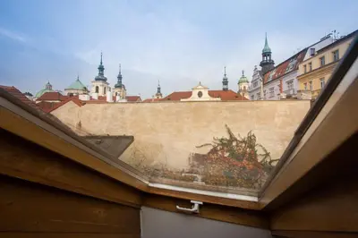 a building with a painting on the side of it at Bohemian Chic 2 Bedroom 2 Bathroom Loft with Hanging Chair in Prague