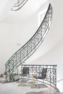 a stairway with two benches and a railing at Hostel Mikoláše Alše in Prague
