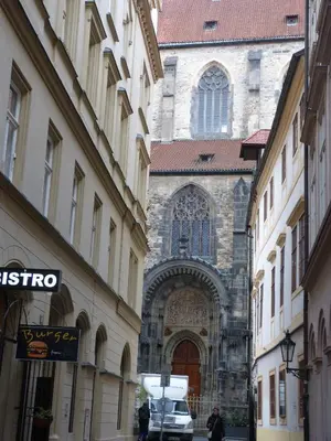 a building with a door in the middle of a street at Apartment by the Old Town Square in Prague