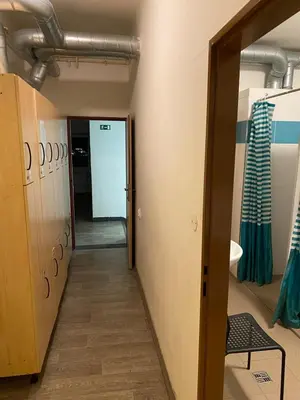 a hallway leading into a dressing room with a door at Easy Housing in Prague