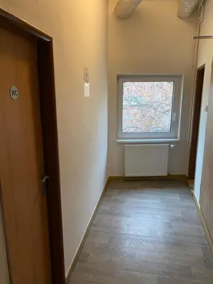 an empty room with a window and a door at Easy Housing in Prague