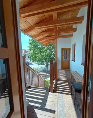 a view of a porch with a wooden pergola at Apartmány Malý mnich in Mníšek pod Brdy