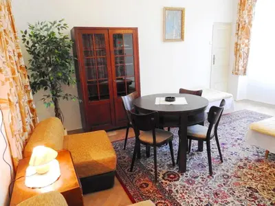 a living room with a table and a couch at Apartment Havelska 10 in Prague