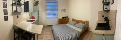 a kitchen counter with a sink in a room at Apartmán Lucián in Prague