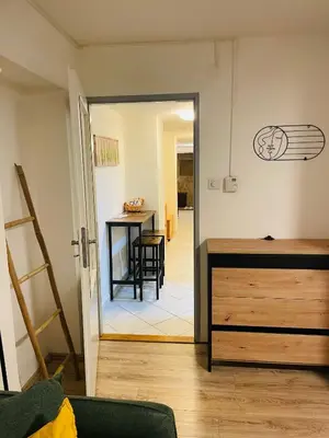 a room with a wooden dresser in a room at Apartmán Lucián in Prague
