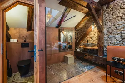 a bathroom with a shower and a glass door at Old Town Apartment in Prague