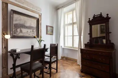 a room with a desk and a mirror and a dresser at Old Town Apartment in Prague