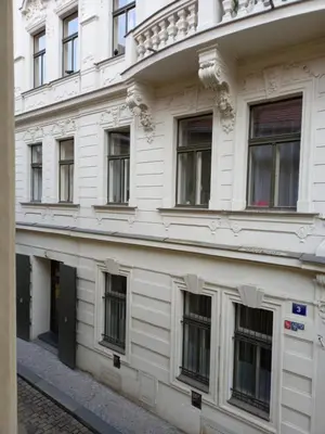 a white building with a bunch of windows at Old Town Apartment in Prague