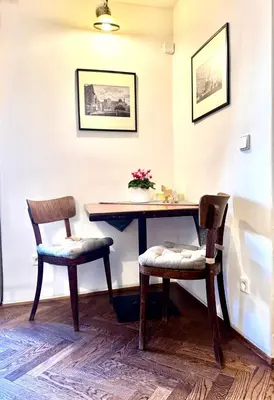 a table and two chairs in a room at Apartmány Nerudova 36 in Prague