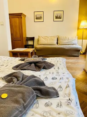 a living room with two beds and a couch at Apartmány Nerudova 36 in Prague