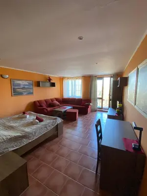 a living room with a couch and a table at Penzion Na Hradbách in Louny