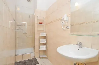 a bathroom with a sink and a shower at Old Town Square Apartments in Prague