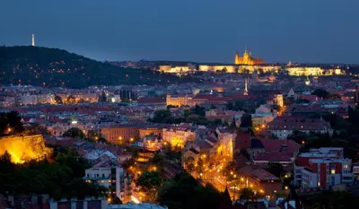 a view of a city at night with lights at Holiday Inn Prague by IHG in Prague