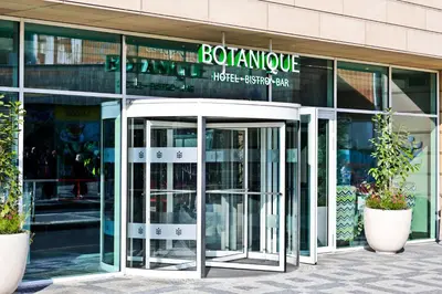 an entrance to a building with two revolving doors at Botanique Hotel Prague in Prague