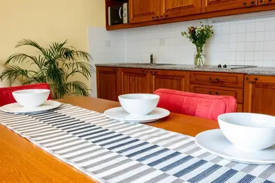 a table with two white bowls on top of it at Pavilon in Ricany