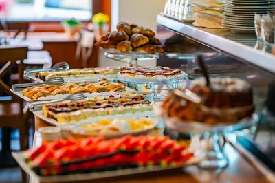 a buffet with many different types of food on display at Metropolitan Old Town Hotel - Czech Leading Hotels in Prague