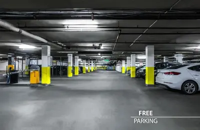 a parking garage with cars parked in it at Metropolitan Old Town Hotel - Czech Leading Hotels in Prague