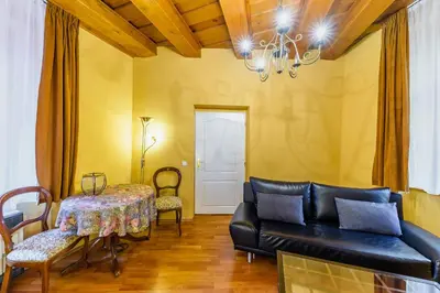 a living room with a couch and a table at Residence Seven Angels in Prague