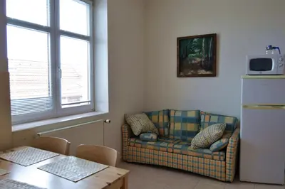 a living room with a couch and a table at Pravouhla in Prague